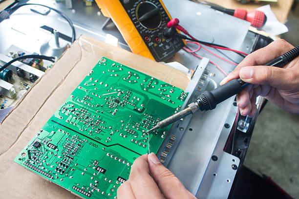 Soldering TV circuit board